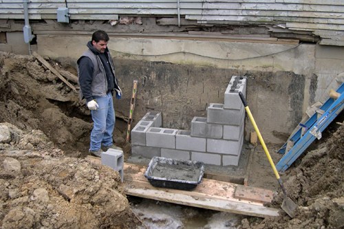 Scotty with new footing for fireplace