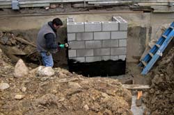 Scotty applying waterproofing