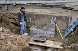 Scotty with new footing for fireplace